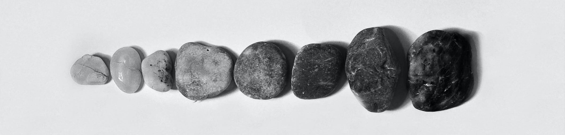 Stones getting bigger and darker from left to right.